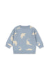 Blue sweater with dinosaur prints on a white background