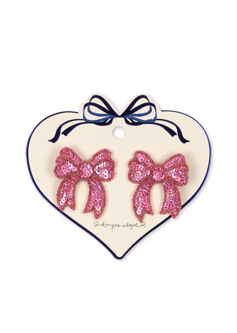 Heart-shaped card with pink sequin bow earrings on a white background
