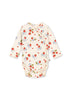 A sleeveless newborn bodysuit with long sleeves, decorated with a floral pattern in shades of red and gray, and a snap button at the crotch.