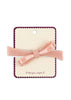Pink bow hair clip on a branded card with a white background