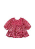 Pink sequin dress on a white background