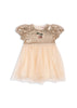 A gold and blush colored sparkling dress with short puff sleeves and a layered tulle skirt with decorative sequins on the top.