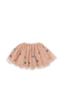 A voluminous pink skirt with tulle layers and sequin details on a white background