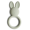 A green silicone bunny teether with a ring handle, designed for baby's sensory play.