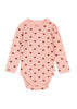 Pink baby onesie with heart pattern on a white background
