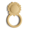 A yellow silicone teether in the shape of a lion's head with a ring for easy gripping.