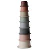 A set of 8 stacking cups in varying shades of gray, blue, and pink, stacked in a tower shape.